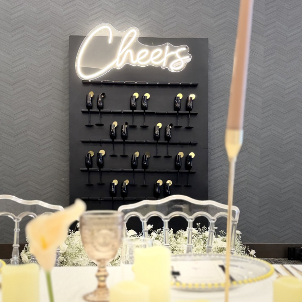 champagne wall with neon sign